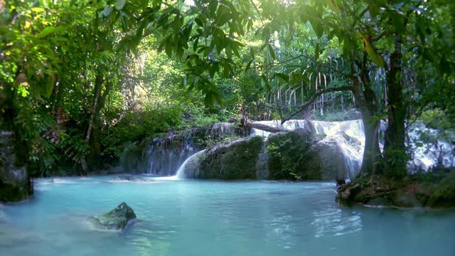 Spectacular view of Erawan cascade waterfall. Kanchanaburi National Park, Thailand. Original audio, sound of rushing water. Beautiful fantasy. Azure river. Lush tropical vegetation of sunny jungle