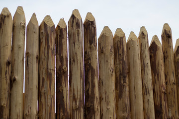 log fence, new, unpainted, natural wood