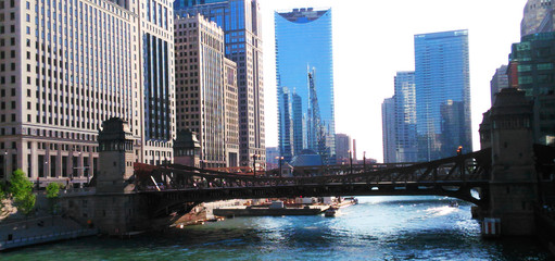 chicago bridge over the chicago river with sky scrappers on the background