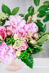 Beautiful bouquet with peonies, roses and Queen Anne's lace flowers.