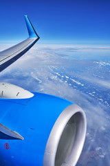 Shooting from the plane. Fragment of the wing and engine