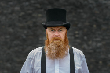 Attractive redhead bearded man in vintage fashion