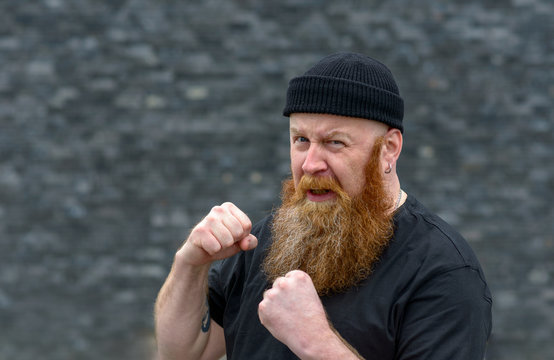 Angry aggressive man making a fist