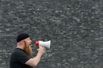Man with a grievance yelling into a megaphone