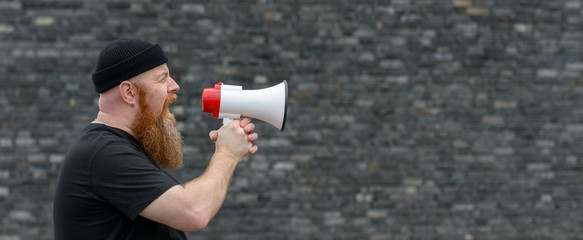 Man with a grievance yelling into a megaphone
