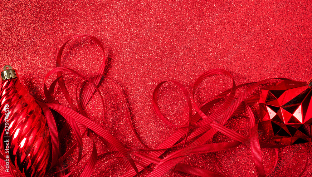 Poster christmas and happy new year red background.top view of ribbon decoration ball on sparkling table.ho