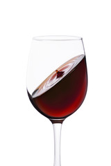 splash of red wine in glass isolated on white background.