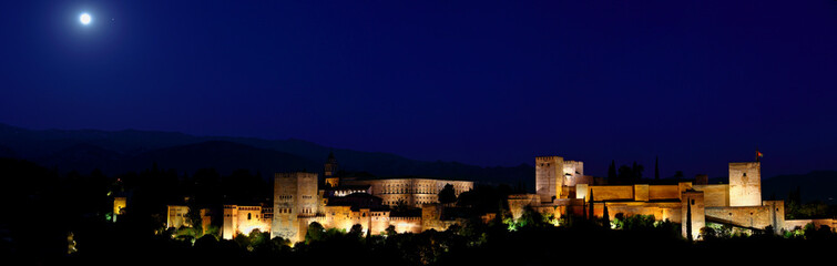 Fototapeta na wymiar Panoramic view of Alhambra palace in the blue hours, Granada - Andalusia, Spain, viewed from Mirador San Nicolas. 