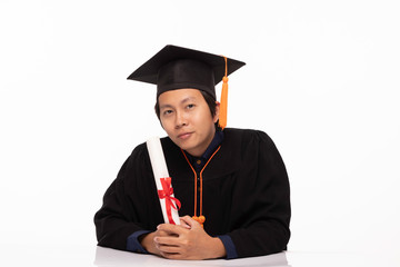 Asian Graduate man in cap and gown smile with certificated or diploma so proud and happiness in Graduation day,Isolated on white Background,Education Graduation Concept
