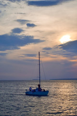 sailboat on the sea at sunset