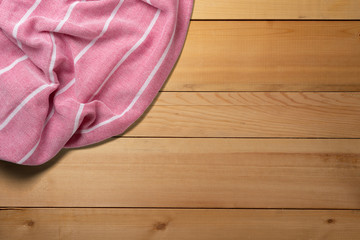 Towel. Scarf. Cover for picnic. On wooden table. Summer concept element. Top view.