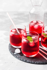 Red alcoholic coctail with ice and mint