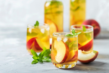 Summer cold tea with peaches and mint
