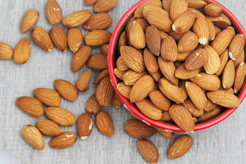 A bowl with almond at white background