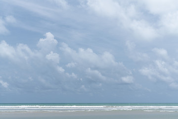 Cloudy sky in middle of the day with  blue sea and white wave in the picture /background texture / blue sky / high resolution