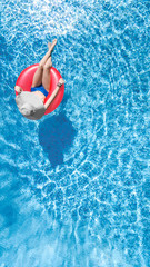 Beautiful young woman in hat in swimming pool aerial top view from above, young girl in bikini...