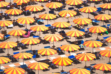 Fototapeta na wymiar Detail of umbrellas on the beach on the Romagna coast in Italy