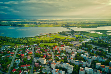 Aerial view of Slatina city at sunset, Romania. Drone flight over the european city at sunset.