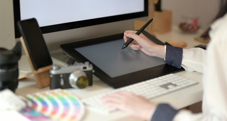 Young graphic designer drawing