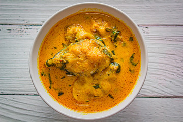 Spicy catfish with red curry in thai food.