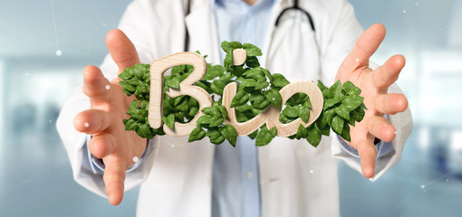 Doctor holding Wooden logo bio with leaves around 3d rendering