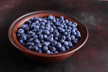 Blueberry antioxidant organic superfood in a bowl concept for healthy eating and nutrition