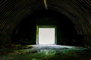 gas masks stand on the table in a dark prison