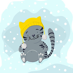 Cute kitten in winter hat playing in the snow
