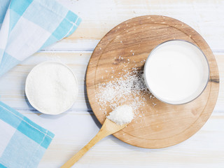 Glass of milk with grated coconut