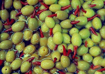 olives with hot red paper, chilli, picking from plants during harvesting, green