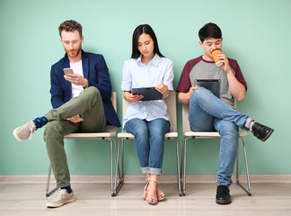 Young people waiting for job interview indoors