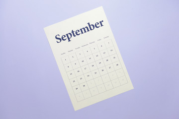 Sheet of paper calendar on color background