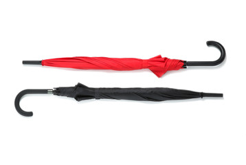 Stylish umbrellas on white background