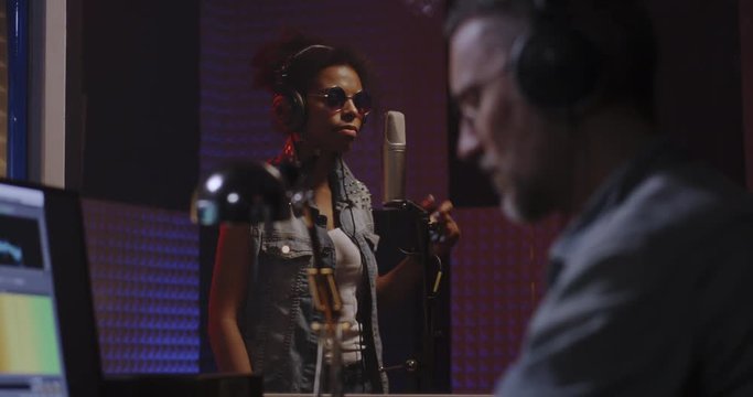 Vocalist and sound engineer working in studio