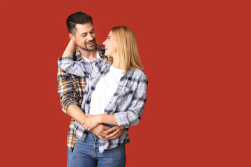 Portrait of happy couple in love on color background