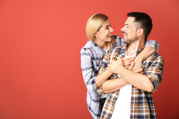 Portrait of happy couple in love on color background