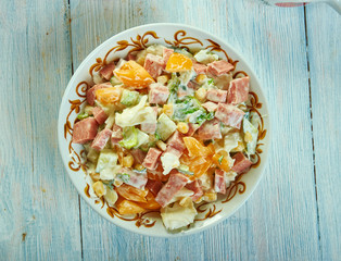 Cabbage salad with ham, cucumber and corn