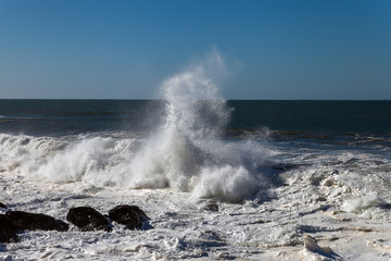 Fototapeta na wymiar Splashing Atlantic ocean wave at Portugal coast.