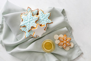 Composition with tasty Christmas cookies on light background