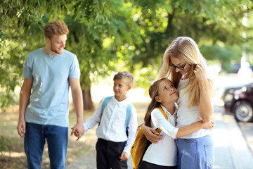 Fototapeta premium Little children going to school with their parents