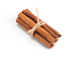 Spice cinnamon wrapped with rope on a white background