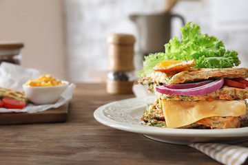Plate with tasty squash waffles on table, closeup