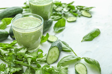 Glasses of healthy vegetable smoothie on table