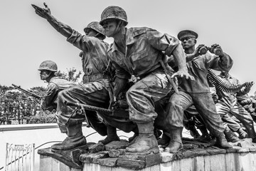 Monument with fighting Soldiers Company for peaceful reunification in War Memorial of Korea....