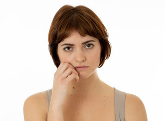 Fototapeta premium Portrait of sad and serious woman. Isolated in white background. Human expressions and emotions