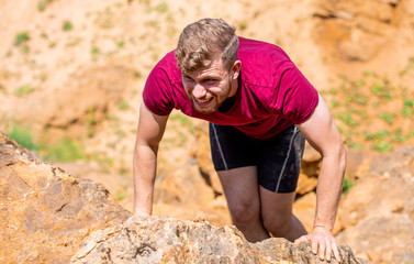Runner during obstacles course training in the boot camp