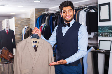 Man demonstrating suit in shop