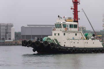 a tugboat returning to port