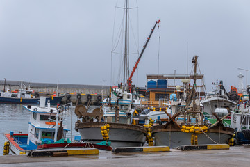 fishing boats anchored at the pier, jeju island korea.