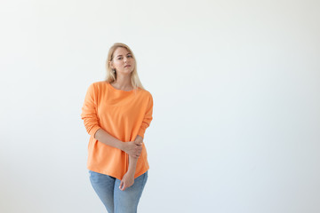 Portrait of pretty young woman in casual clothes posing on a white background. Space for reference links or advertising